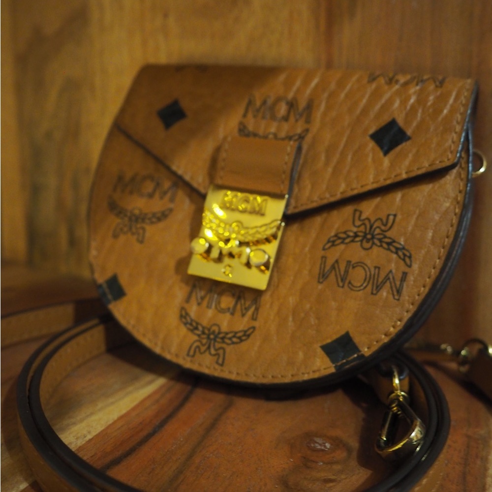Selling this gorgeous authentic leather MCM wallet on strap